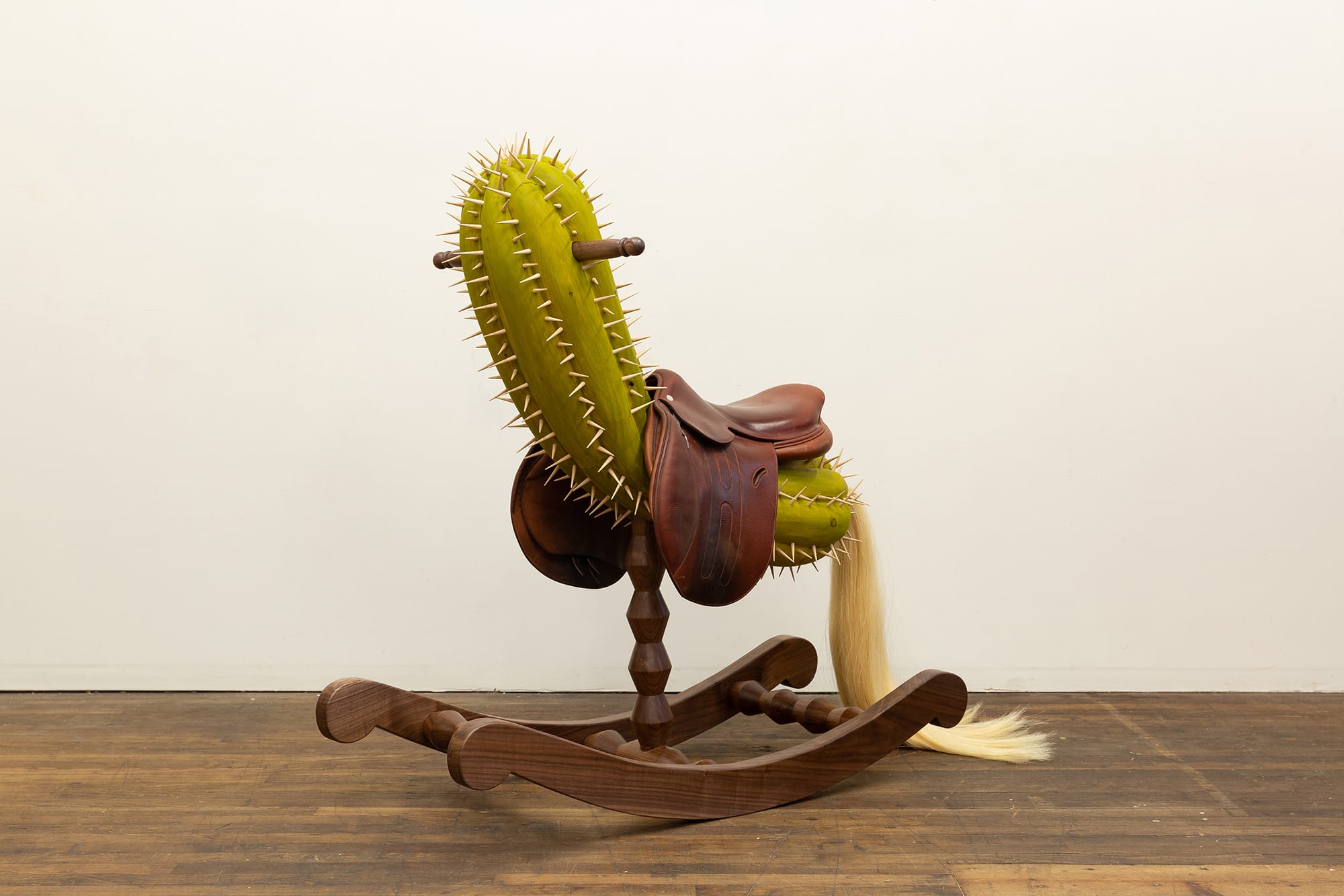 a rockinghorse like sculpture with a cactus seat by Raul De Lara