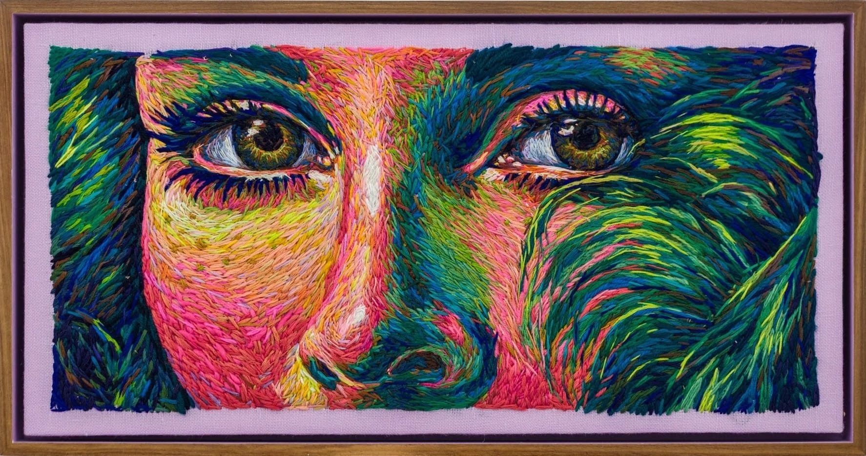 a crewel embroidery composition by Danielle Clough of a woman's eyes and nose