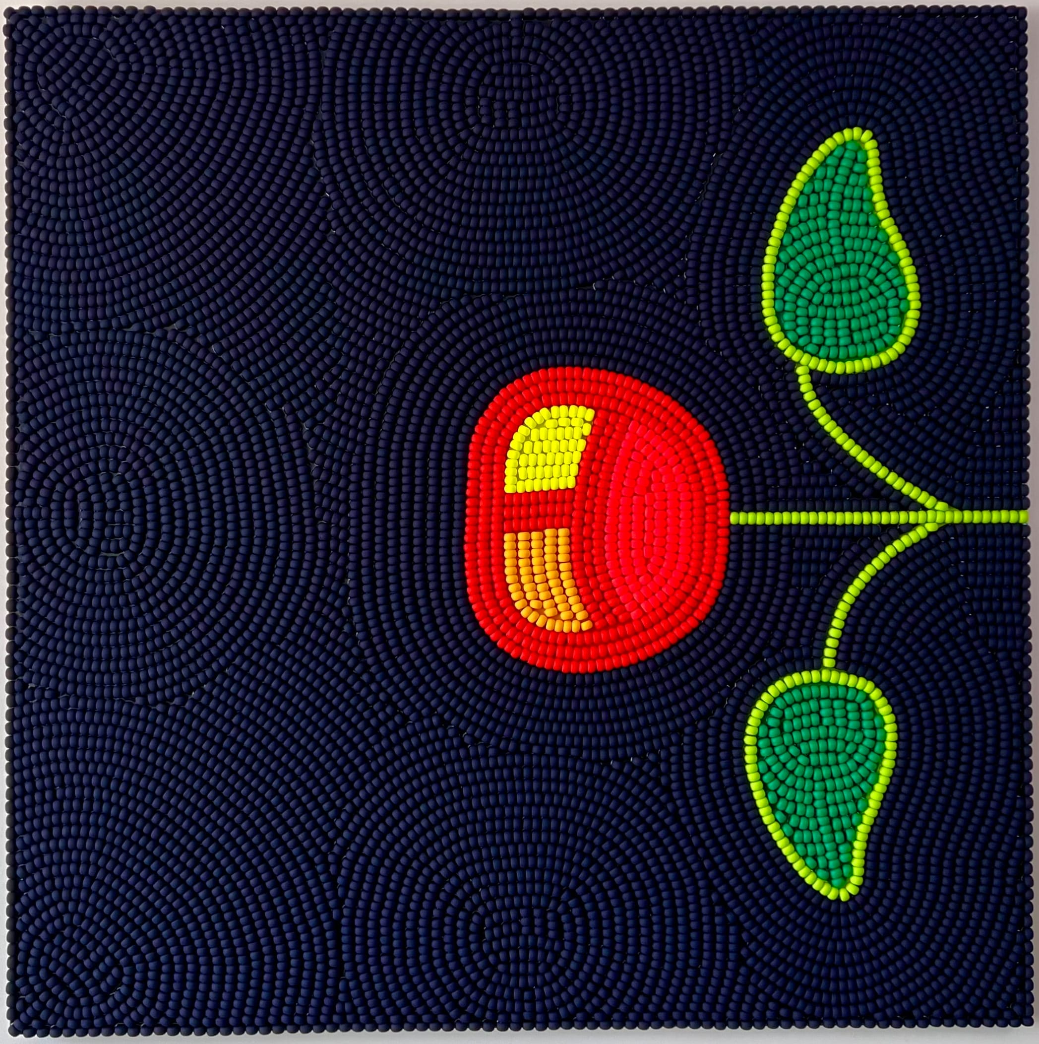 a wooden bead piece by Renee Condo of a cherry emerging from the left side