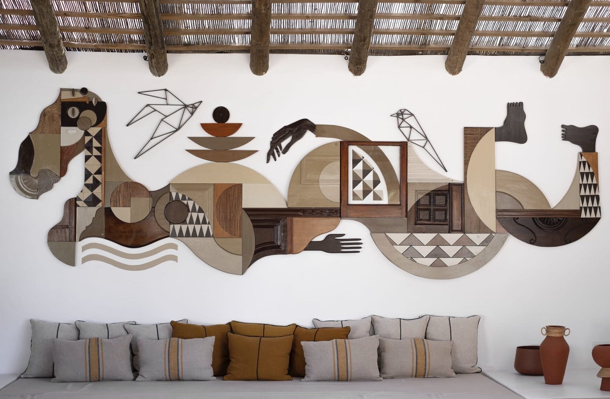 a wall installation by Expanded Eye made of wood in various patterns, colors, and textures