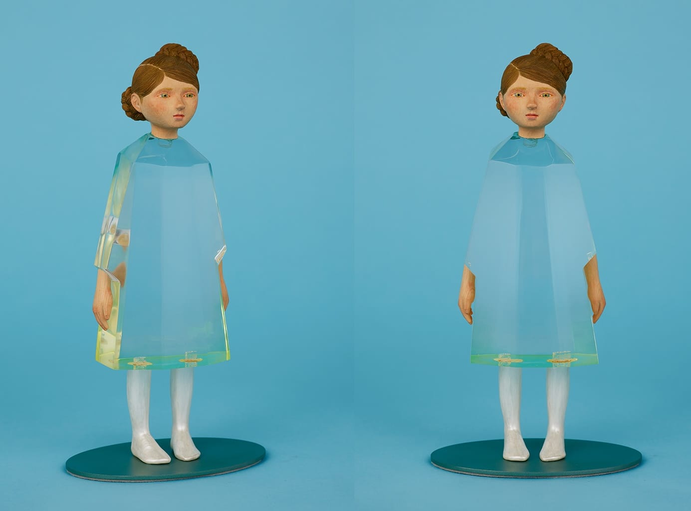 two views of a sculpture by Ayako Kita of a young woman with a carved wood head and clear resin dress