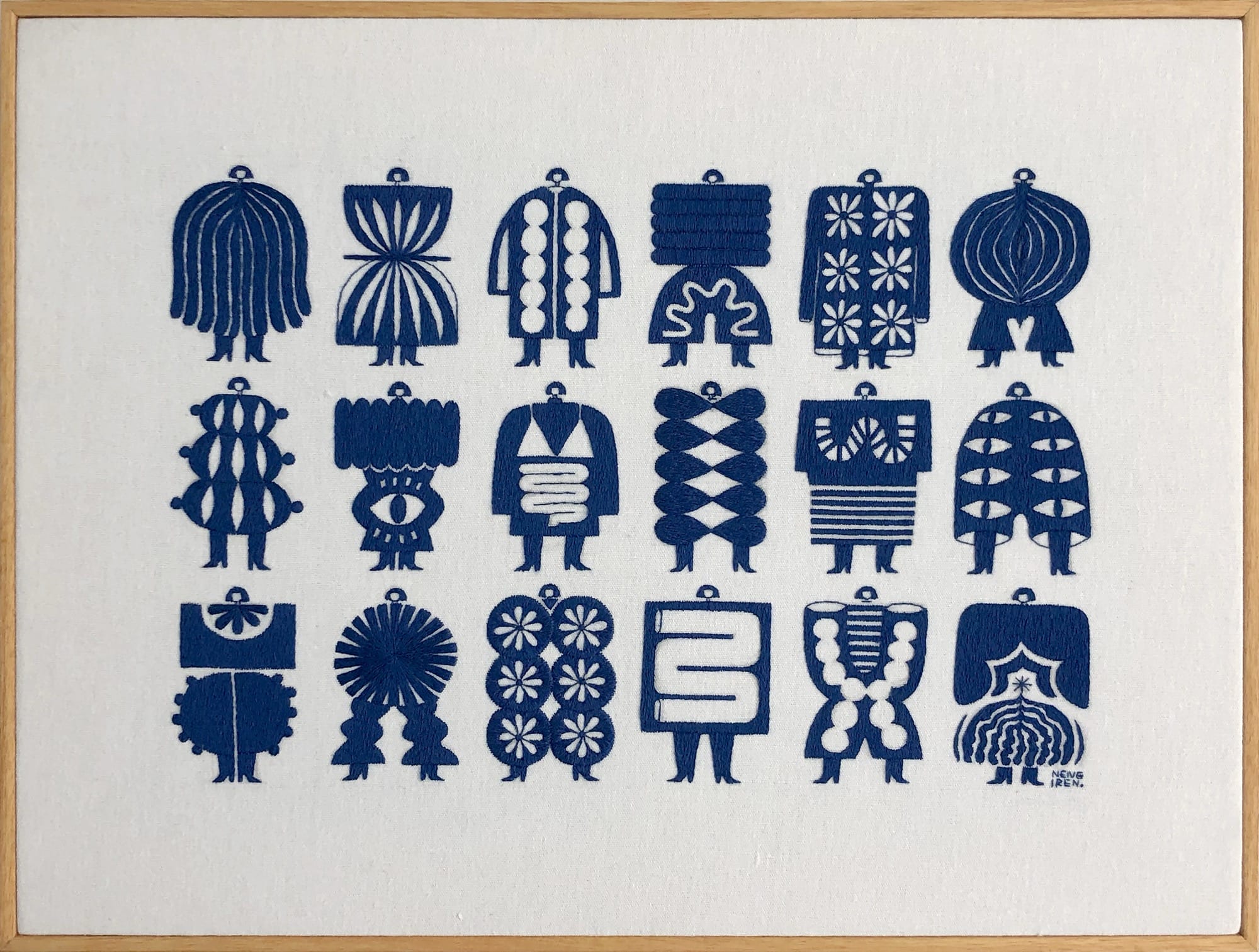 an embroidered artwork by Irene Saputra of a rectangular grid of blue, patterned, symmetrical, abstractly shaped figures