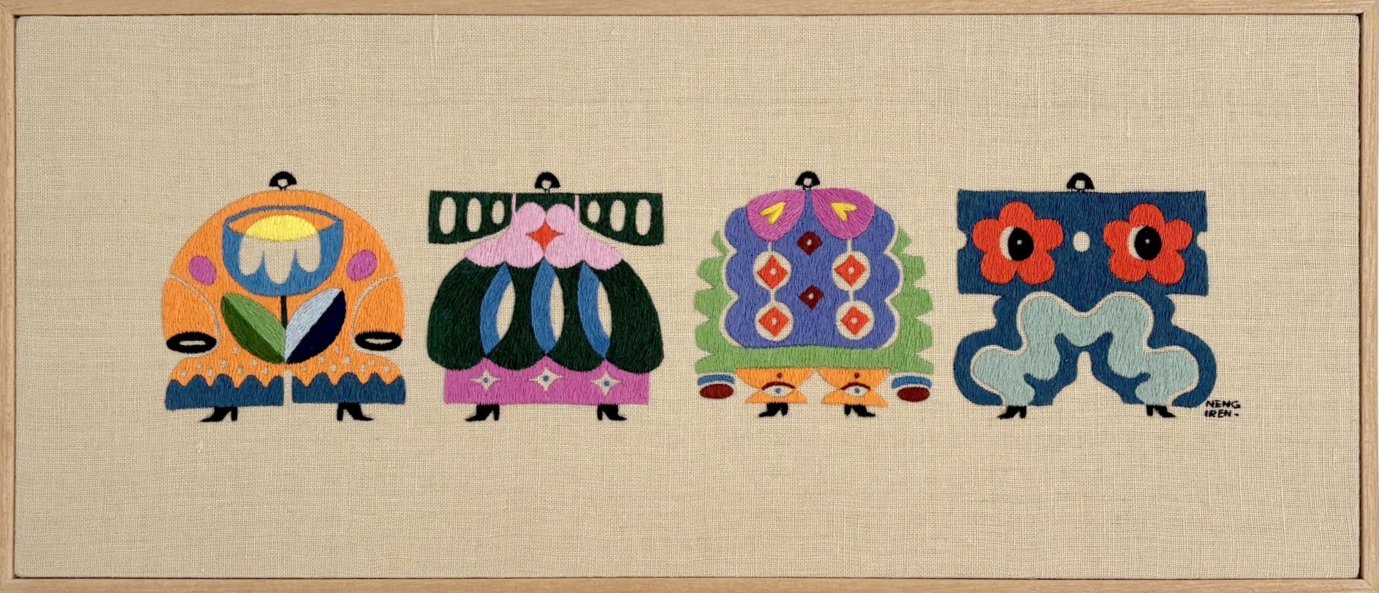 an embroidered artwork by Irene Saputra of four colorful, patterned, symmetrical, abstractly shaped figures