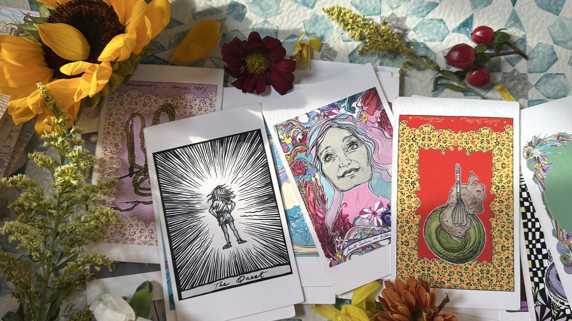 a display of illustrated oracle cards by Swoon