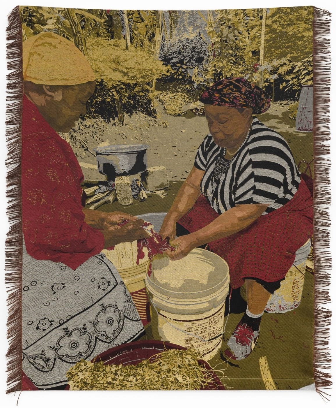 a woven Jacquard tapestry by Malaika Temba of two women preparing food and using a large pail