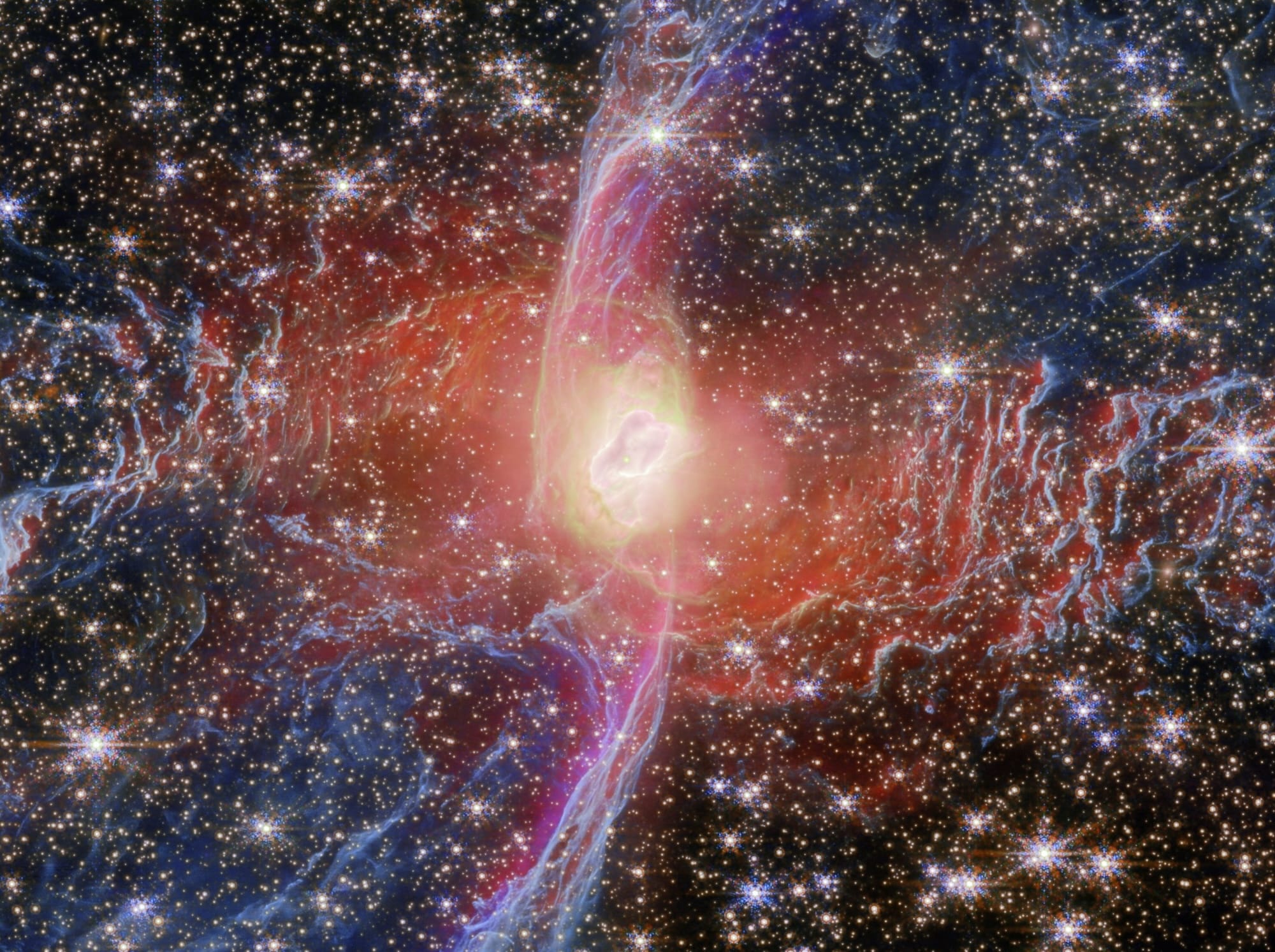 a detail of the bright nucleus star of the Red Spider Nebula, captured by the Webb space telescope