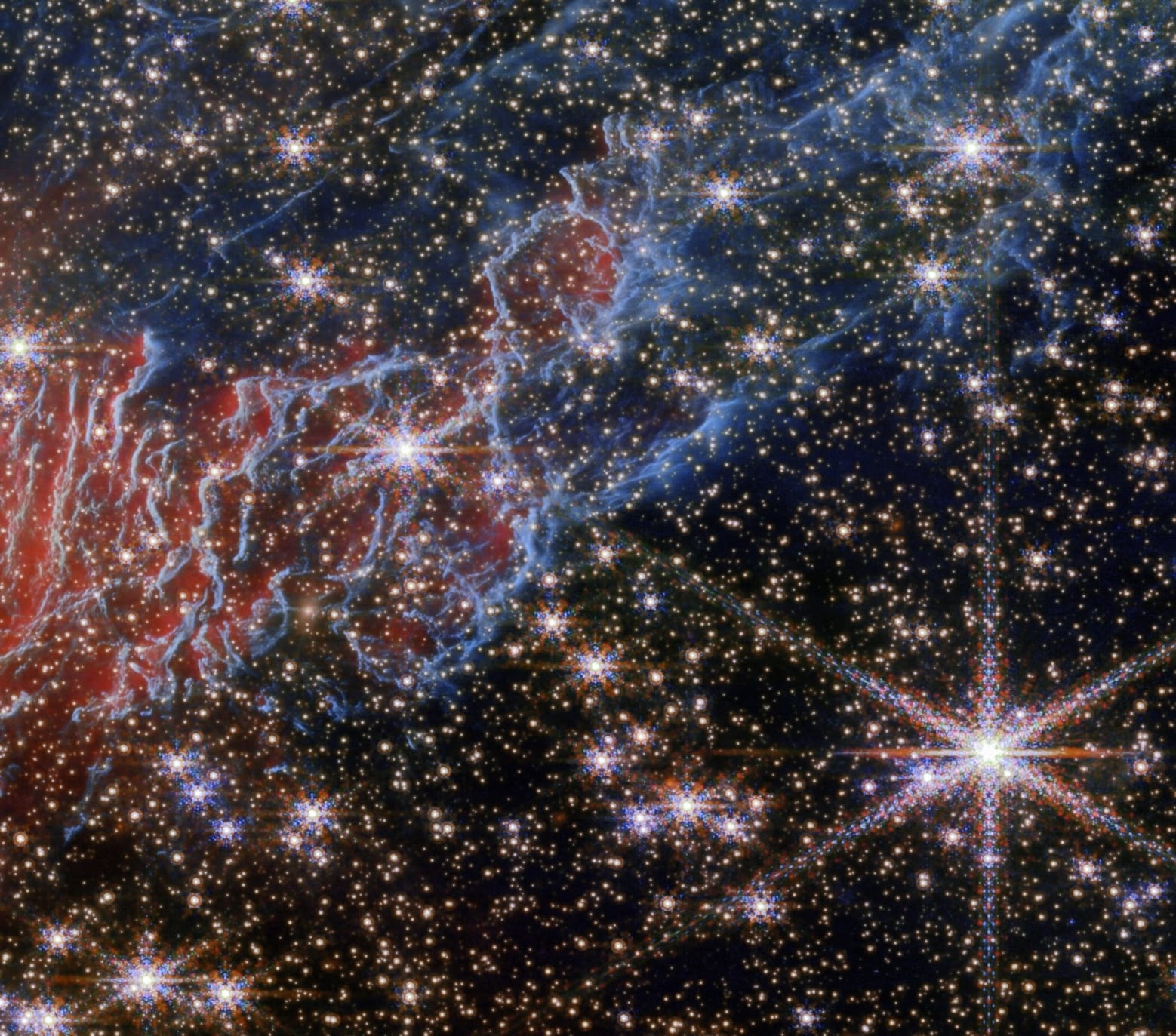 a detail of a gas cloud of the Red Spider Nebula, captured by the Webb space telescope